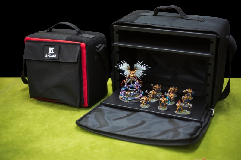 Two A-Case carrying cases with a painted army on the table